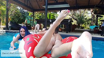 Play Two naked girls fooling around in the pool