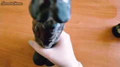 Play Jerking off a massive black dildo with gloves in POV