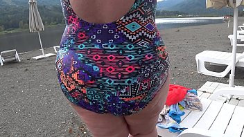 Play BBW with big booty in tight jeans is dressing in a public dressing room on the beach. Fetish.